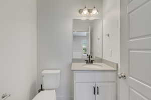 Bathroom with vanity and toilet