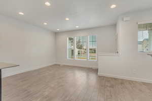 Unfurnished room with light wood-type flooring