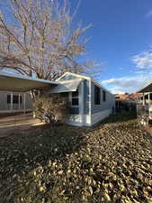 View of property exterior with a carport