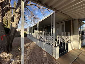 View of side of home with covered porch