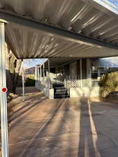 View of patio / terrace with a carport and a porch