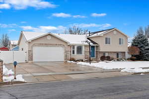 Tri-level home featuring a garage