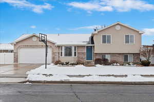 Split level home featuring a garage