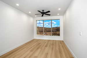 Spare room featuring ceiling fan, light hardwood / wood-style floors, and a textured ceiling