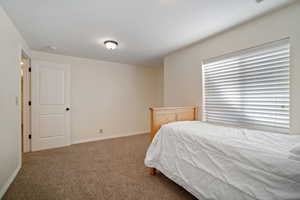 View of carpeted bedroom