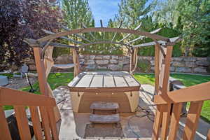 View of patio / terrace with a hot tub