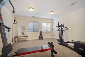 Exercise room featuring carpet flooring