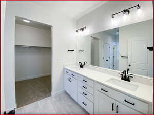 Bathroom featuring vanity and tile patterned floors