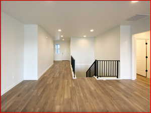 Unfurnished room featuring hardwood / wood-style floors