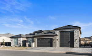 View of front facade featuring a garage