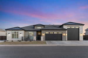 Prairie-style home featuring a garage