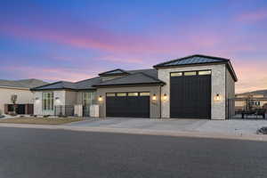 View of front of property featuring a garage