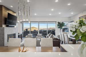 Living room with a wealth of natural light and a tiled fireplace