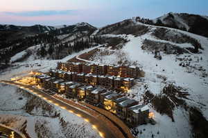 Snowy aerial view with a mountain view