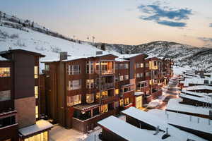 Snow covered property featuring a mountain view