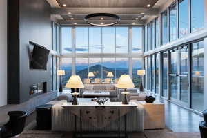 Living room featuring a wealth of natural light, expansive windows, and hardwood / wood-style floors