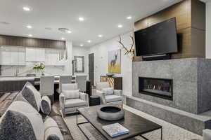 Living room with sink and a fireplace