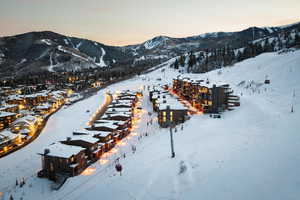 Snowy aerial view featuring a mountain view