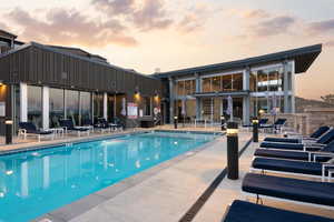 Pool at dusk with a patio