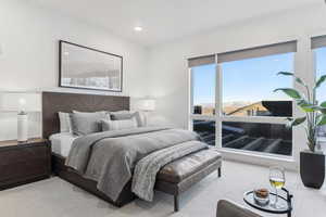 Carpeted bedroom with a mountain view