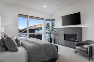 Bedroom featuring a fireplace