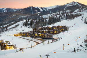 Snowy aerial view featuring a mountain view