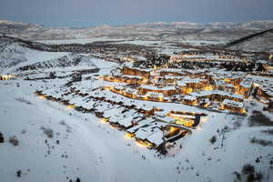 Snowy aerial view featuring a mountain view