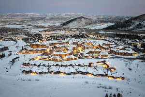 Snowy aerial view featuring a mountain view