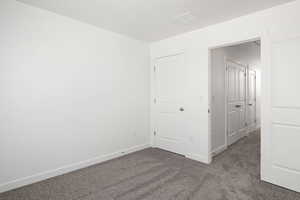 Unfurnished bedroom featuring carpet floors