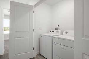 Laundry room featuring washer and clothes dryer