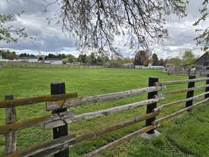 View of yard with a rural view