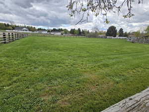 View of yard with a rural view