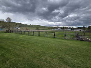 View of yard with a mountain view and a rural view