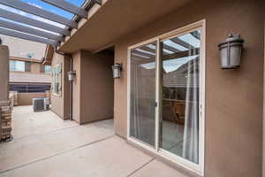 View of patio / terrace featuring cooling unit