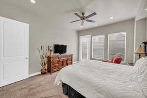 Bedroom featuring ceiling fan and light colored carpet