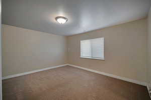 Empty room featuring carpet floors