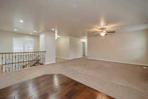 Spare room featuring ceiling fan and carpet floors