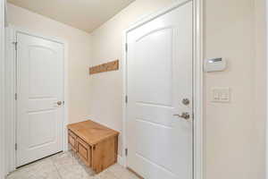 Mudroom featuring light tile patterned floors