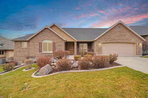 Ranch-style house with a yard, a garage, and cooling unit