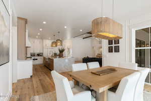 Dining area featuring light hardwood / wood-style floors and sink