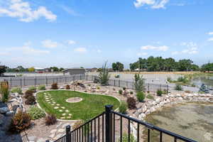 View of yard with a water view