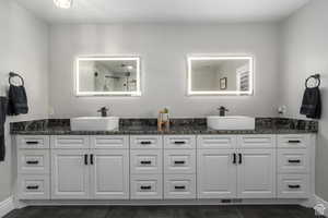 Bathroom with vanity and walk in shower