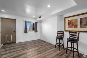 Interior space with dark hardwood / wood-style flooring