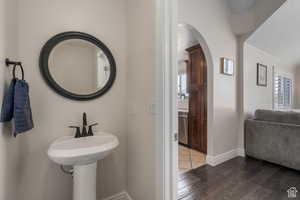 Bathroom with sink and hardwood / wood-style flooring