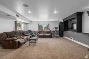 Carpeted living room with a healthy amount of sunlight