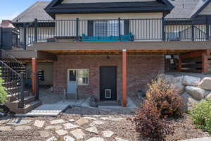 Rear view of property with a patio and a deck