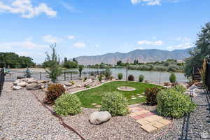 View of yard featuring a water and mountain view