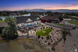 Aerial view at dusk with a water and mountain view