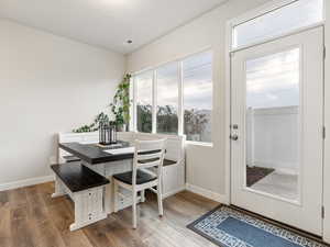 Dining space with wood-type flooring