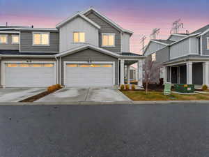 View of front facade featuring a garage